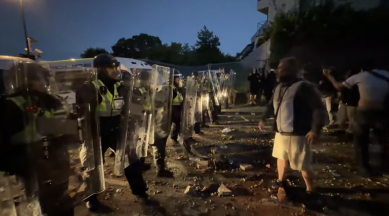Riot Police Engage with Protesters Near Stabbing Incident Site